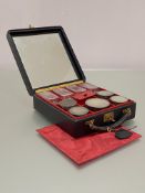 A George VI silver-mounted travelling toilet set, the black morocco case opening to a fitted