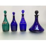 A group of coloured glass decanters, c. 1800 and later comprising: a green mallet-form decanter