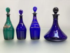A group of coloured glass decanters, c. 1800 and later comprising: a green mallet-form decanter