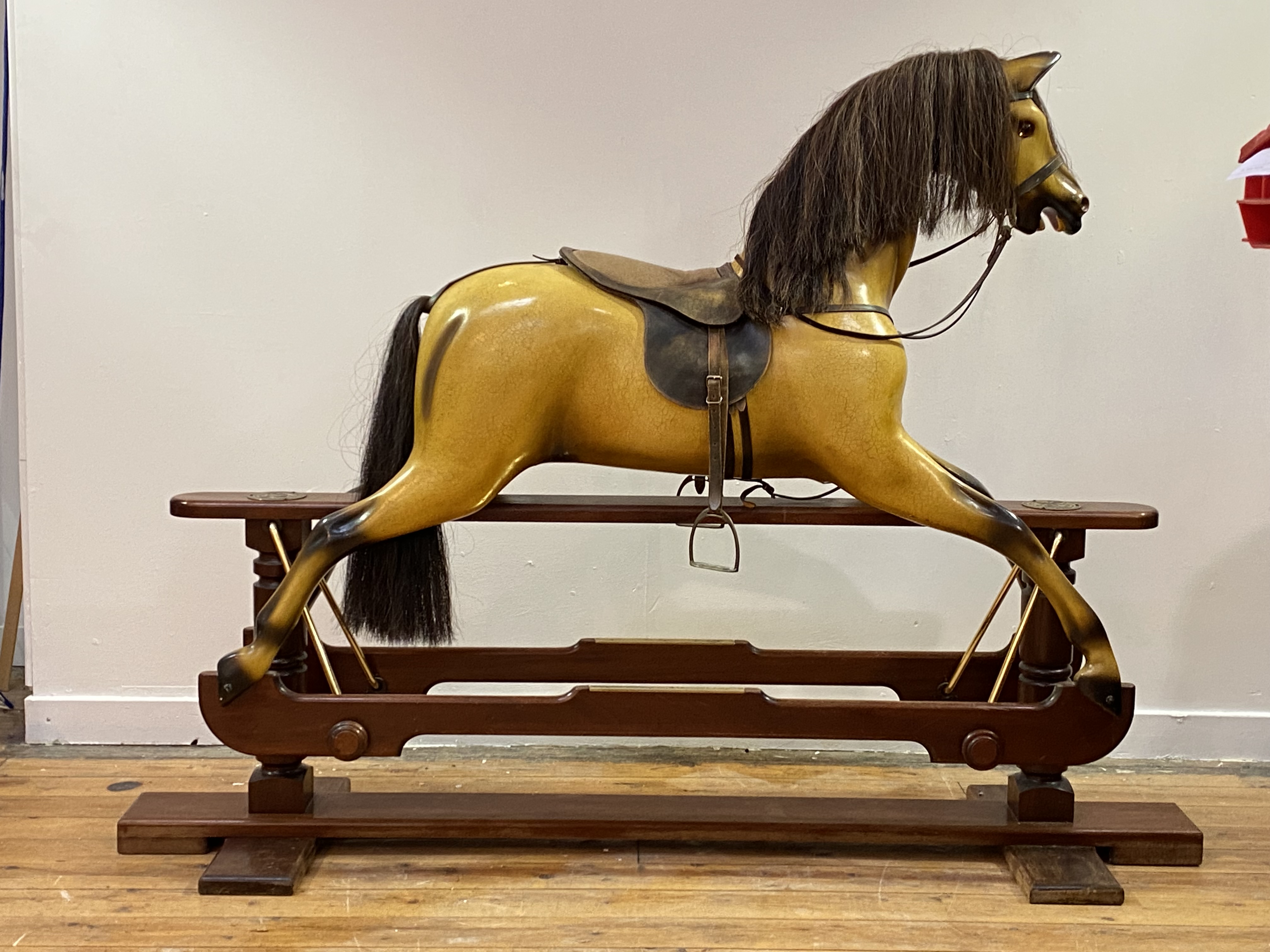 A Whittingham Crafts Ltd. carved and painted wooden trestle rocking horse, painted mustard, with - Image 2 of 3