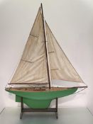 A large pond yacht, first half of the 20th century, with single mast, simulated planked deck over
