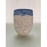 •Clare Conrad (British, b. 1948), a textured stoneware vessel, with a band of blues to the rim,