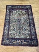 A fine Persian paradise garden rug, hand knotted, the central panel depicting the tree of life on an