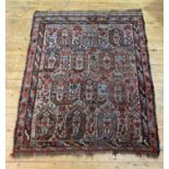 An antique Khamseh rug, hand knotted, the busy field of all over geometric design and bordered,