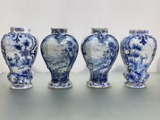 Two pairs of blue and white Delft vases, 18th/19th century, each of shaped baluster form, the