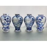Two pairs of blue and white Delft vases, 18th/19th century, each of shaped baluster form, the