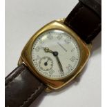 A 1940's 9ct gold Longines gentleman's wristwatch, the white enamel dial with Arabic numerals and