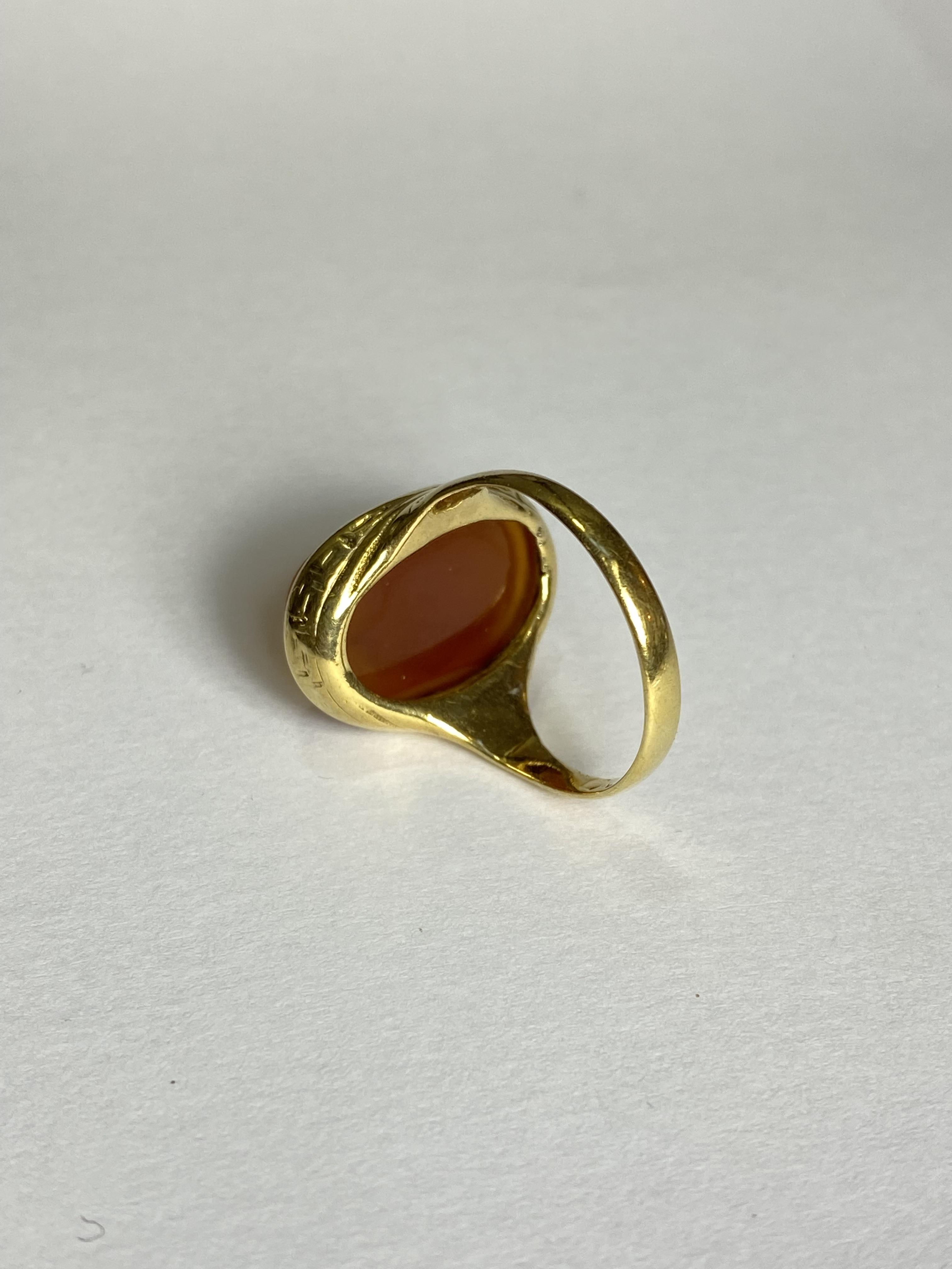 A carved hardstone intaglio ring, the oval agate with a profile bust of a young lady, on an ( - Image 2 of 2