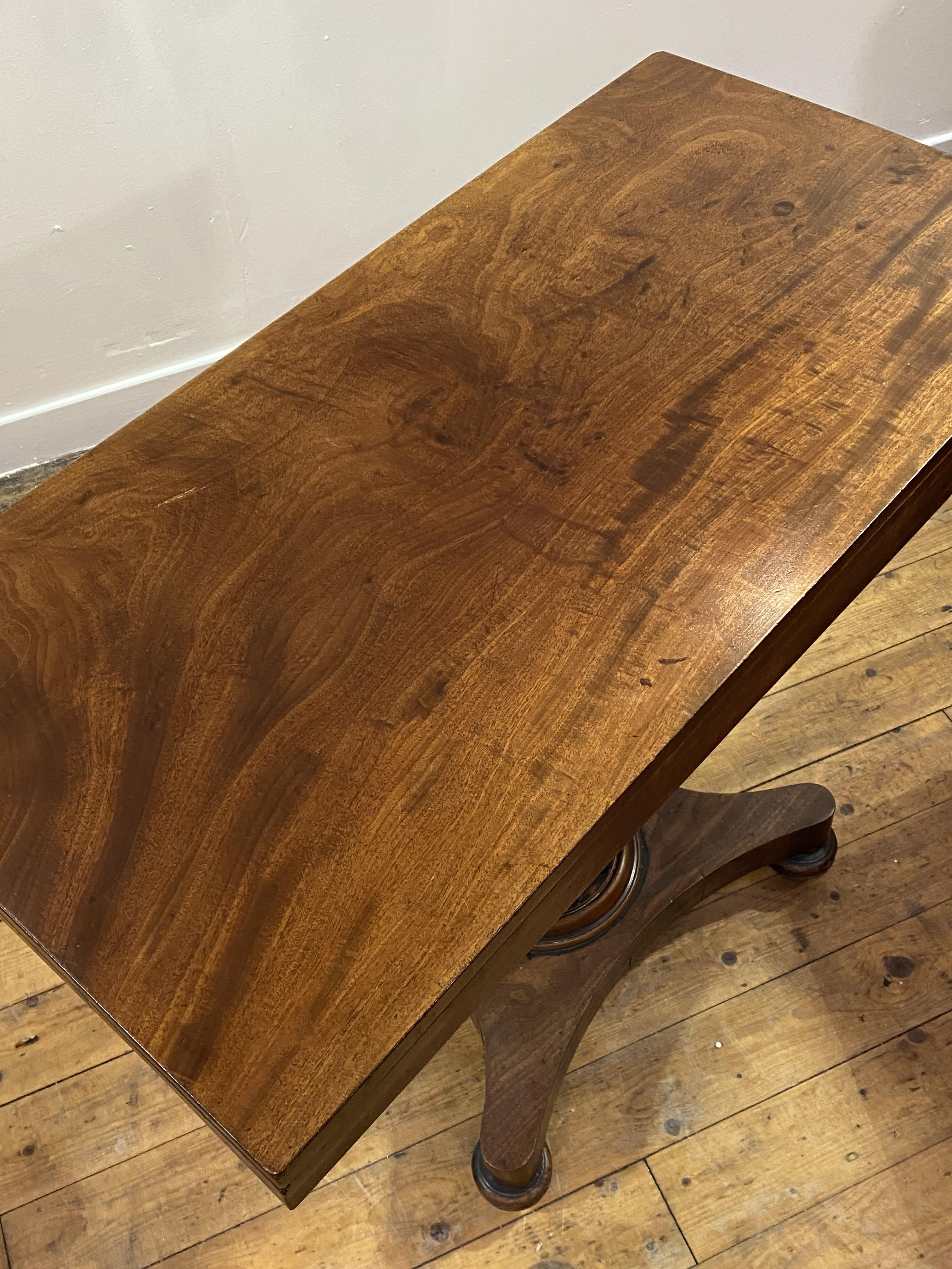 A mid 19th century mahogany supper table, the fold over revolving top over a fluted centre column, - Image 2 of 4