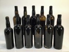 Port - ten bottles, unlabelled but believed pre 1920, some very low level, together with another sli