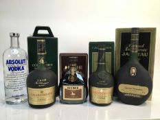 Cognac - three bottles, Hine V.S.O.P., Courvoisier V.S.O.P (2), a bottle of Grand Armagnac Janneau,