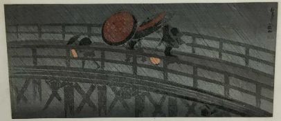 Japanese colour woodblock, - figures on a bridge in rain 36.5cm x 16cm mounted in glazed frame