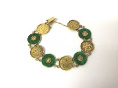 Chinese 18ct gold and jade bracelet, decorated with Chinese characters