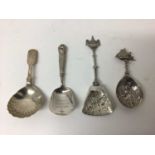 Four silver caddy spoons, including two continental and two Victorian