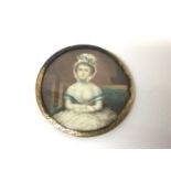 Georgian portrait miniature on ivory of a young woman, shown seated with her arms crossed, in gilt f