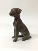 Bronze sculpture of a seated dog, 17.5cm high