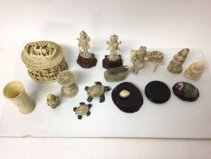 Group of antique ivory, including a pair of Indian figures of gods, a dice shaker, a relief carved b