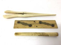Pair of ivory glove stretchers, an ivory parallel rule, and a Japanese ivory cheroot holder carved w
