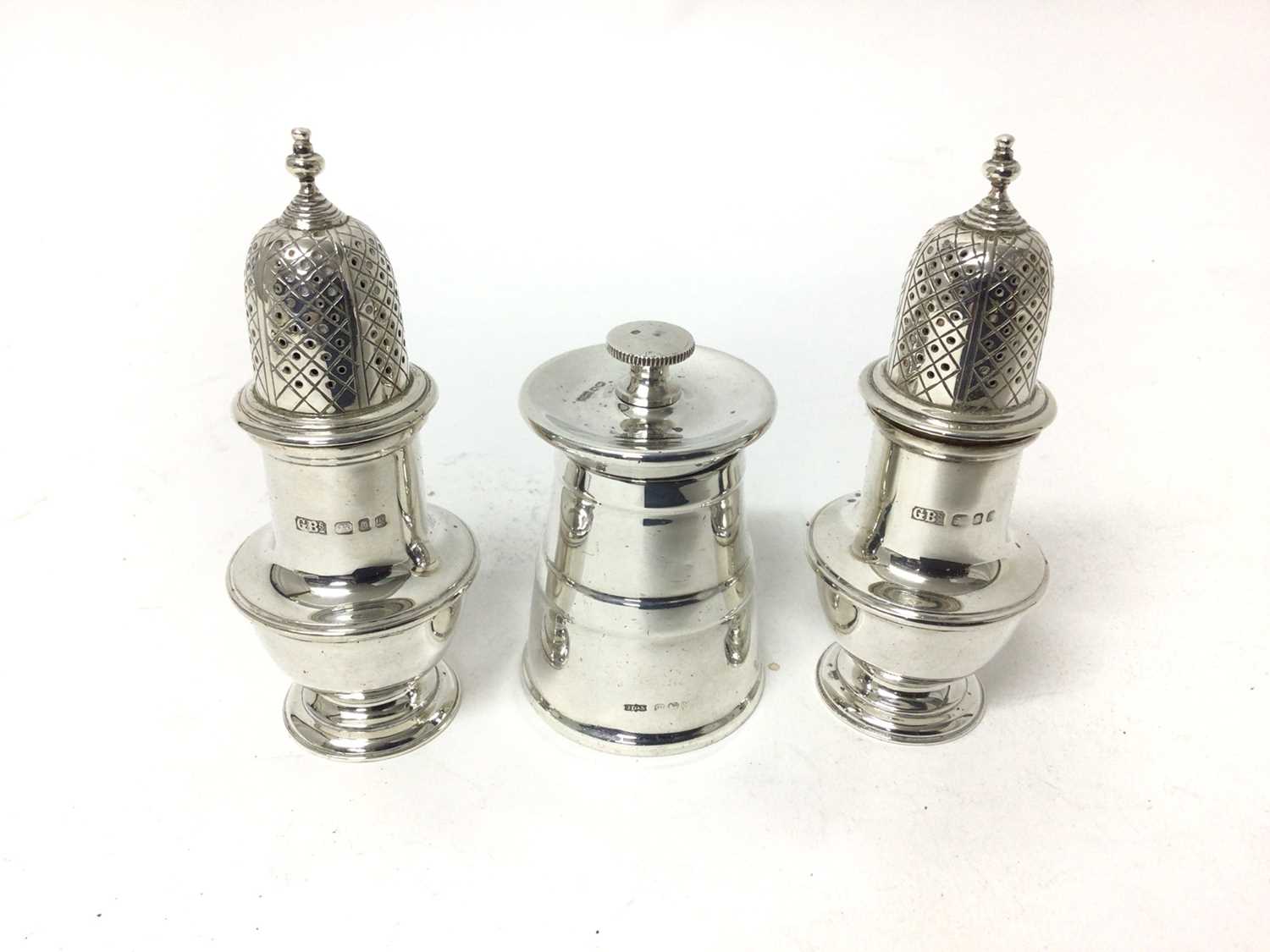 Silver pepper grinder, James Dixon & Sons, Sheffield 1940, together with a pair of silver casters, L