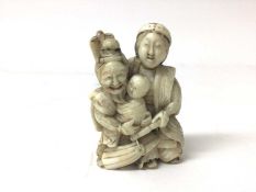 19th century Japanese ivory figure group of a samurai, wife and child, 6.5cm high