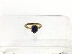 Blue sapphire single stone ring, on gold band