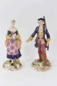 A pair of German porcelain figures of a shepherd and shepherdess, in Derby style