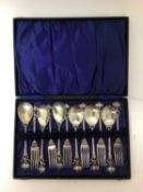 Set of Art Nouveau silver plated dessert cutlery comprising six spoons and six forks with hammered b