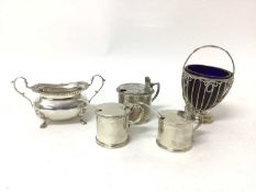 Three silver mustards (two with spoons, one with liner missing), a silver sugar basket with liner, a