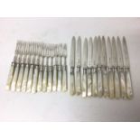 Two near sets of Edwardian silver and mother of pearl cutlery, including twelve knives and twelve fo