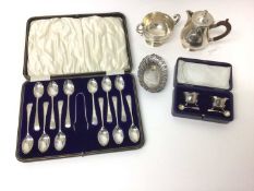 Silver hot water/hot milk jug, set of twelve silver teaspoons and sugar tongs in fitted case, pair o