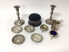 Quantity of silver, including a pair of candlesticks, pin cushion, milk jug, a set of four embossed