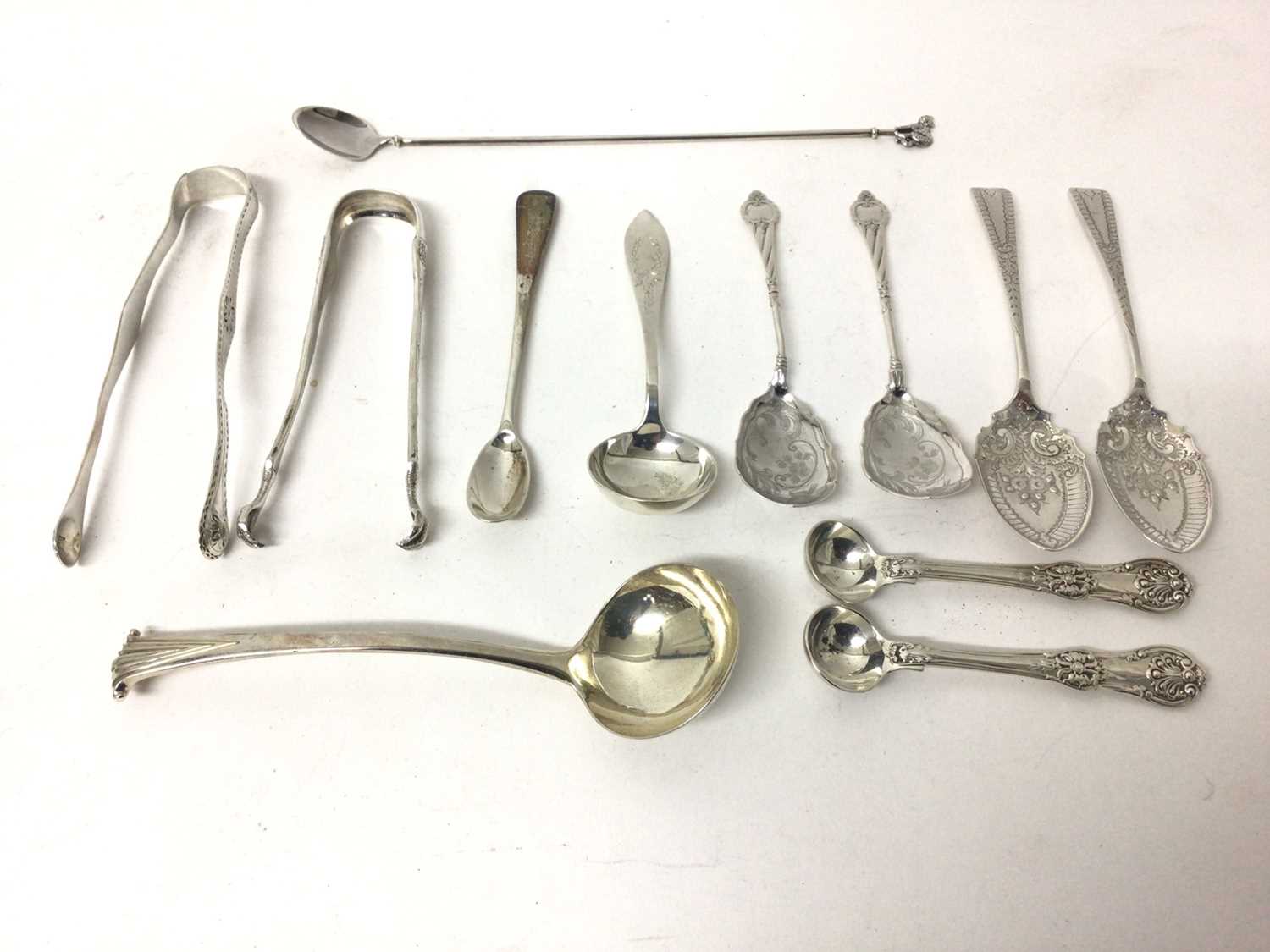 Collection of silver, including a pair of Tiffany sugar tongs, a Georgian pair of tongs, a small Geo