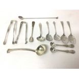 Collection of silver, including a pair of Tiffany sugar tongs, a Georgian pair of tongs, a small Geo