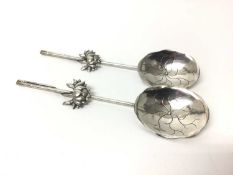 Pair of Chinese silver spoons with lotus flower bowls, hallmarks to the handles