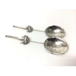 Pair of Chinese silver spoons with lotus flower bowls, hallmarks to the handles