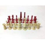 Complete set of 19th century bone and red stained ivory chess pieces
