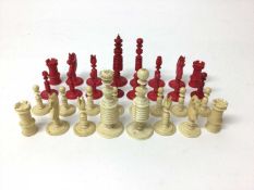 Complete set of 19th century bone and red stained ivory chess pieces