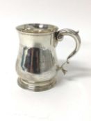 George II style silver pint tankard of baluster form, London 1938.