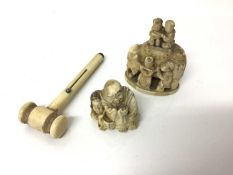 Japanese carved ivory netsuke, together with an okimono and a carved ivory combination gavel and pen