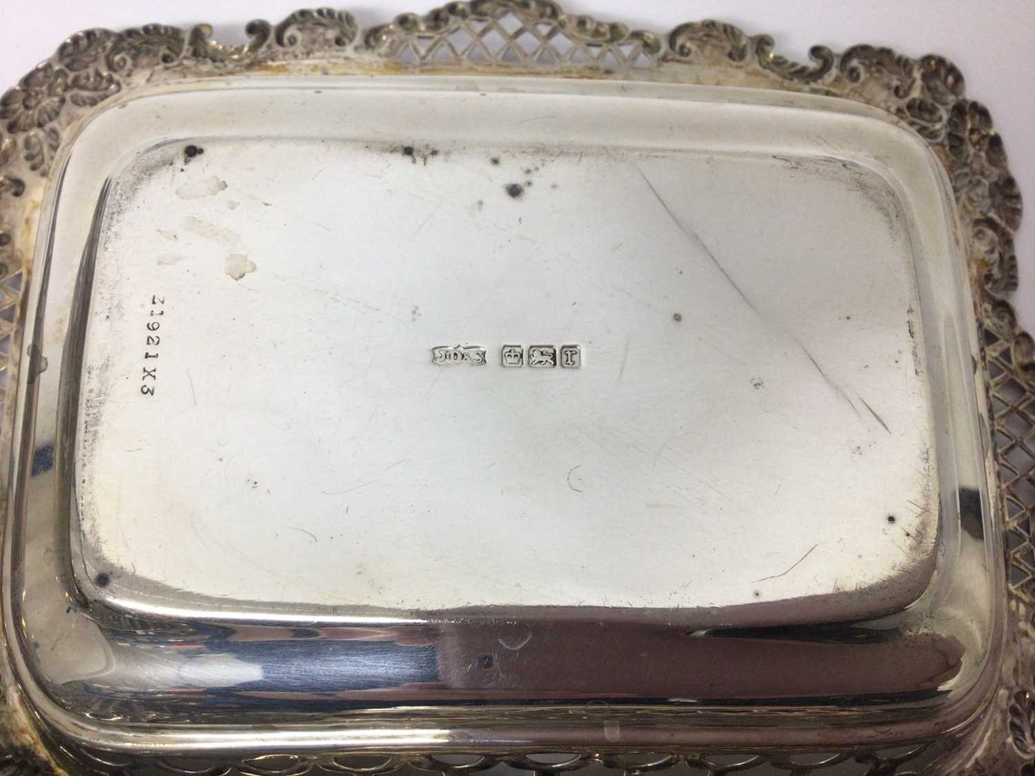 Three silver graduated rectangular dishes with pierced and floral decoration and one other oval silv - Image 3 of 7