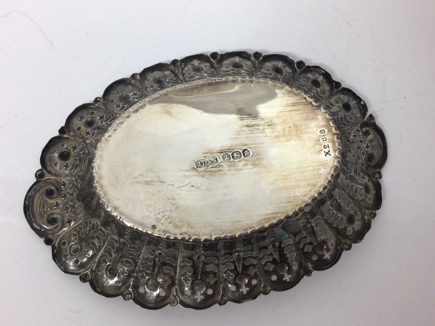 Three silver graduated rectangular dishes with pierced and floral decoration and one other oval silv - Image 6 of 7