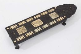19th century Chinese black hardwood cribbage board, with carved floral decoration, inlaid ivory mark