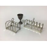 Two silver toast racks, Birmingham 1933 and Sheffield 1954, and a continental silver egg cup