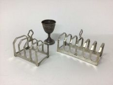 Two silver toast racks, Birmingham 1933 and Sheffield 1954, and a continental silver egg cup