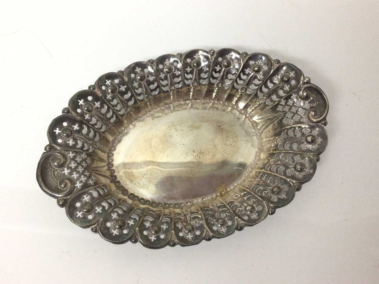 Three silver graduated rectangular dishes with pierced and floral decoration and one other oval silv - Image 7 of 7