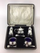 Silver five piece cruet set in fitted box