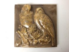Unusual 1920s ceramic plaque with relief moulded decoration depicting two birds