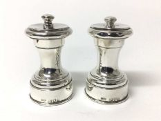 Pair of late Victorian silver pepper mills, hallmarked London 1899 maker John Grinsell & Sons