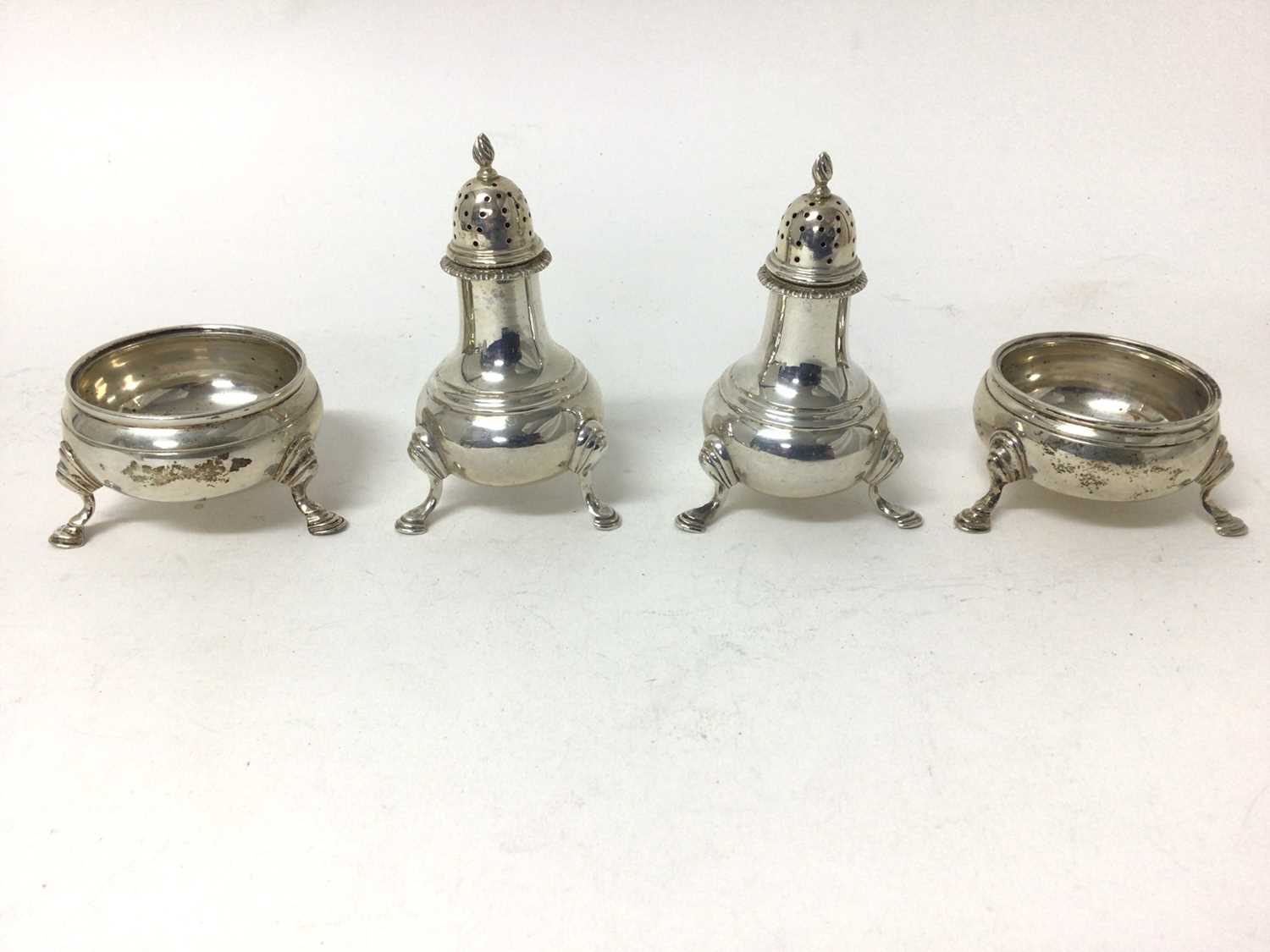 Sterling silver four-piece cruet set, London 1957 and 1968, with hoof feet
