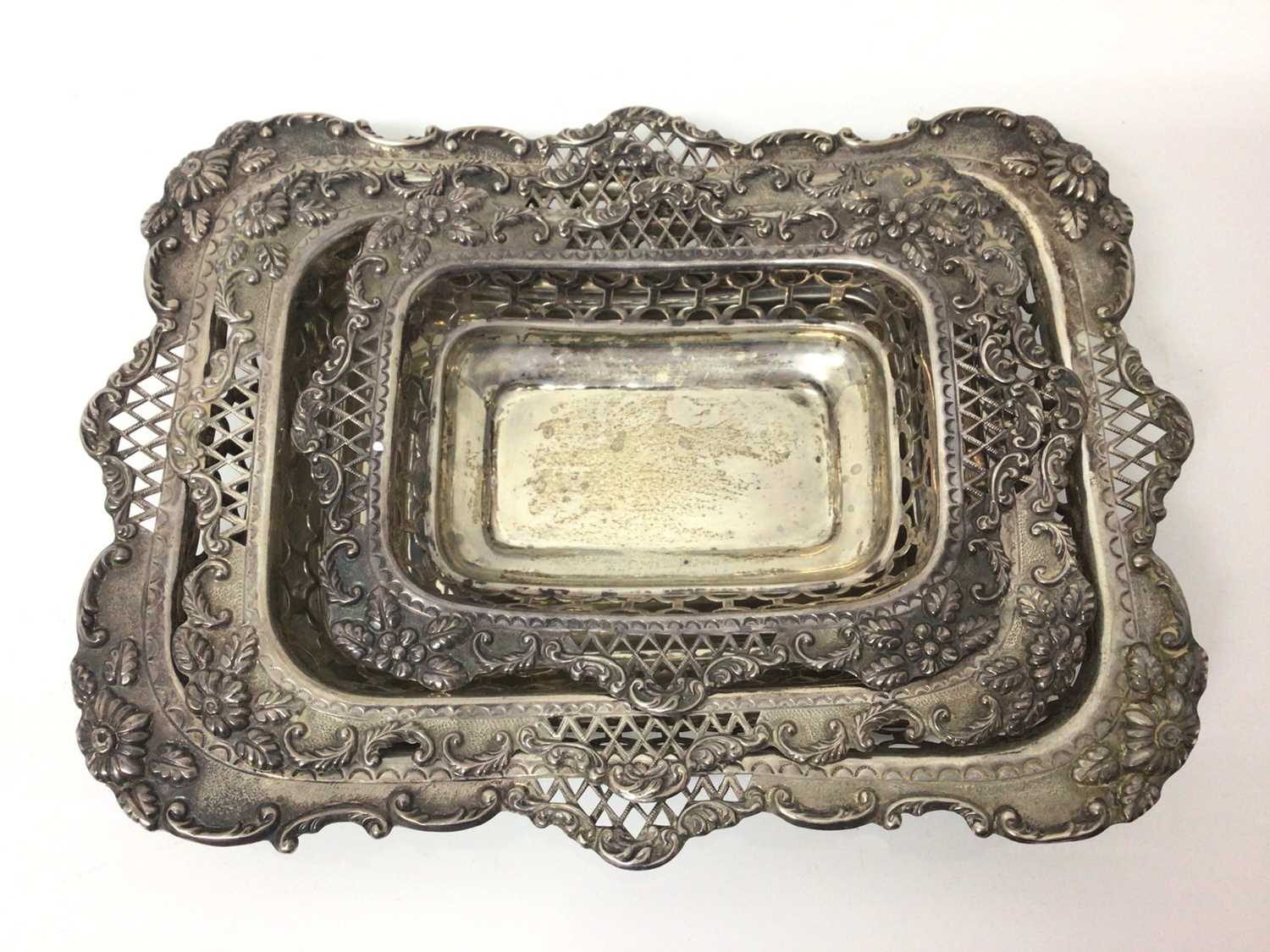 Three silver graduated rectangular dishes with pierced and floral decoration and one other oval silv - Image 5 of 7